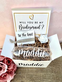 the bridesmaid gift box is filled with personalized items