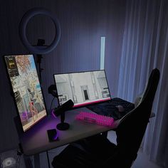 a desk with a computer, keyboard and mouse in front of a curtained window