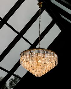 a chandelier hanging from the ceiling in a room