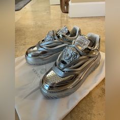 Brand New (Never Worn). Comes With Box Luxury Silver Sneakers For Sports, Mens Silver Luxury Shoes, Luxury Metallic Silver Men's Sneakers, Luxury Silver Low-top Sneakers, Luxury Metallic Silver Lace-up Sneakers, Versace Shoes, Versace Men, Mens Shoes Sneakers, Top Sneakers