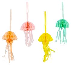 four different colored jellyfishs hanging from strings on a white background, one is yellow and the other is pink