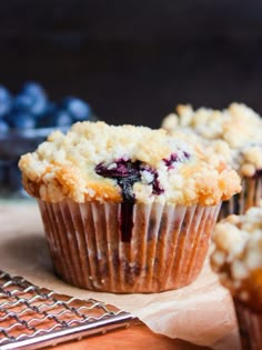 blueberry muffins with crumbled topping on top