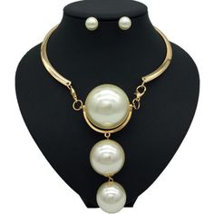 Description Here is a stylish Gold Pearl Necklace which not only modifies your look but also adds value to your personality. The Pearl has a soft glamour which makes it look very beautiful. There are two colors on this necklace available which are Gold and Silver. One can wear these necklaces for any occasion or ceremony. Features Material:Metal, Copper Alloy Pattern:Geometric Color:Gold /silver Pendant material:Pearl What Includes 1*Necklace 1 Pair ofEarrings Measurement Earrings Height: 0.90 i White Alloy Jewelry Sets For Gifts, Chic Alloy Dangle Jewelry, Chic Dangle Alloy Jewelry, Elegant White Alloy Jewelry, Chic Alloy Necklaces For Party, Formal Round Alloy Necklace, Formal Alloy Necklaces, Elegant Formal Alloy Necklace, Elegant Alloy Pendant Necklace