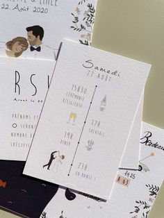 the wedding stationery is laid out on top of each other