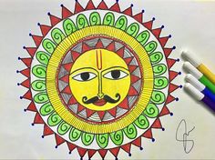 a drawing of a sun with a mustache on it's face and two colored pencils next to it