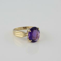 10K Yellow Gold Amethyst Solitaire Ring, oval faceted rich purple amethyst, 8.5 x 10.5mm, folded ribbon top shank, 3/8 inch across, Ring size 5 7/8, Circa 1970, 2.8 grams SKU# BB280R13 This listing contains photographs of the actual item you will receive. Our items are in excellent condition with little or no signs of wear and many are one of a kind pre-owned estate finds. Please look closely at the pictures in this listing as they are part of the product description. Please read the description Formal Purple Oval Cabochon Jewelry, Formal Amethyst Oval Cabochon Jewelry, Formal Amethyst Jewelry, Oval Cabochon, Timeless Oval Purple Amethyst Ring, Formal Faceted Amethyst Ring Fine Jewelry, Timeless Purple Oval Amethyst Ring, Classic Oval Purple Amethyst Ring, Classic Amethyst Oval Cabochon Ring, Classic Oval Amethyst Ring