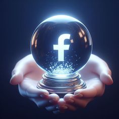 a person holding a crystal ball with facebook logo on it in their hands, against a dark background