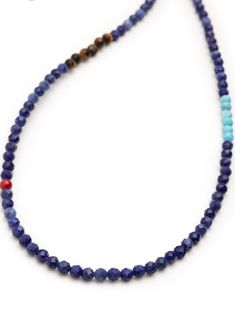 4mm Faceted Dumortierite, Turquoise, and Brown Tiger Eye Beads 4mm Faceted Rondel Hematite Beads Lobster Clasp Closure in Stainless Steel Length: 25 Inches + 1 inch extension Product Code: MNEC_285 Designer's Notes This unique necklace with faceted Dumortierite, Brown Tiger Eye, and Turquoise beads is the perfect summer style. The colors are reminiscent of a Caribbean beach while the red accents that pop out of the blue hues tie all colors perfectly together. Please note that all our pieces are Blue Rondelle Natural Gemstones, Lapis Lazuli Beads With Natural Stones, Round Lapis Lazuli Beads With Natural Stones, Colorful Lapis Lazuli Bead Necklaces, Blue Faceted Beads For Jewelry Making, Colorful Round Lapis Lazuli Bead Jewelry, Colorful Lapis Lazuli Beaded Jewelry, Turquoise Lapis Lazuli Beaded Necklace With Polished Beads, Blue Natural Stone Beaded Necklaces With Oval Beads