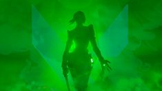 a woman standing on top of a stage with green lights in the backround