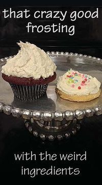 two frosted cupcakes sitting on top of a cake plate with the words, that crazy good frosting with the weird ingredients