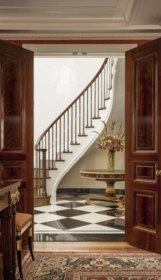 an entry way with a table and stairs