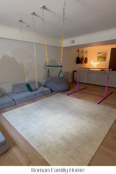 a living room with couches and swings in it