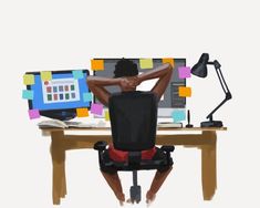 a man sitting at a desk in front of a computer