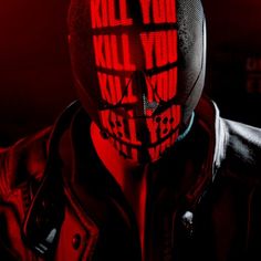 a man wearing a red mask with the words kill you on it