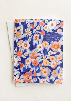 a greeting card with an orange and blue floral pattern