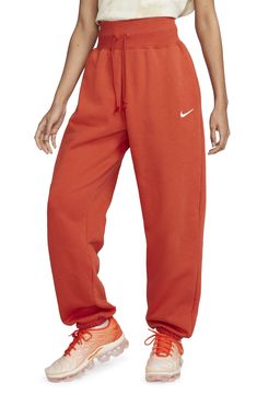 These high-rise sweats made of brushed fleece that fit loose through the hip and thigh are ready for the weekend. 29 1/2" inseam; 12" leg opening; 13" front rise; 18" back rise (size Medium) 80% cotton, 20% polyester Machine wash, tumble dry Imported Nike Fall Loungewear Sweats, Nike Sweats For Loungewear In Fall, Nike Sweats For Fall Loungewear, Fall Streetwear Full-length Sweatpants, Fall Streetwear Full Length Sweatpants, Fall Streetwear Sweatpants With Comfort Waistband, Straight Leg Sweatpants For Fall, Fall Straight Leg Sweats With Ribbed Waistband, Cozy Nike Sweats