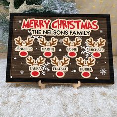 a wooden sign with christmas decorations on it