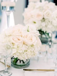 the centerpieces are arranged in glass vases