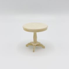 a small wooden table on white background with no one around it or in the photo