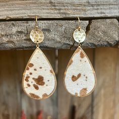 These Spotted Perfection Earrings come in 2 different colors. They are a black and white cow print cowhide and a brown and white cow print cowhide. They are a tear drop design attached to a small gold hammered circle on a fish hook. Cow Hide Earrings, Hide Earrings, Brown And White Cow, Black And White Cow Print, White Cow Print, Black And White Cow, White Cow, Drop Design, Sterling Jewelry