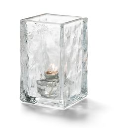 an ice cube with a candle inside it