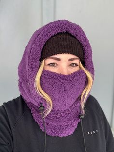 Balaclava - Sherpa FITS OVER HELMET! Fits over most adult helmets as well as over beanies  Hood made with Sherpa fleece Stay warm in style!  Wear with hood up or down, and face mask up or down  Pull strings with cord stops to stay tight  Adult size, fits most!  Beanie hat not included  100% polyester   Dry clean only!  *Pattern placement may vary Windproof Hats For Outdoor Winter Wear, Windproof Winter Hats For Outdoor, Winter Beanie For Outdoor Activities With Fleece Lining, Winter Wear Windproof Hats For Outdoor, Windproof Beanie For Winter, One Size Fits Most, Windproof Hooded Hats For Outdoor, Winter Windproof Beanie One Size Fits Most, Outdoor Windproof Hooded Hats, Winter Sports Warm Balaclava