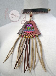 Unleash your bohemian soul with this beautiful one off unique handmade leather necklace. It is made from the finest quality brown leather. The brown leather section of the necklace has vintage hand embroidered Hmong tribal fabric incorporated into it's design. This is not only a necklace it is a piece of art. This long fringe leather choker necklace is adjustable at the back so it fits all sizes. Available in a wide range of colors. Please contact me if you would prefer a different color combina Hand-stitched Adjustable Bohemian Jewelry, Traditional Leather Jewelry For Festival, Artisan Hand-stitched Festival Jewelry, Bohemian Leather Necklace For Festivals, Handmade Brown Hippie Choker, Handmade Brown Bohemian Choker, Artisan Brown Leather Necklace, Adjustable Brown Hippie Choker, Hippie Brown Jewelry For Festivals