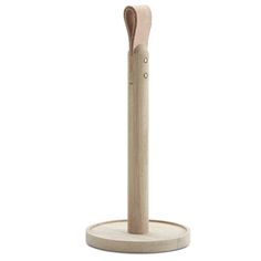 a wooden toothbrush holder on a white background