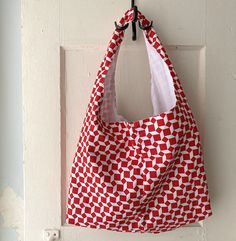 ERRANDS BAG Red and white cubes DEFECT - SALE: red print not completely covering the cubes, leaving some white dots - see photo. Light bag to carry a few errands.  Easy to store when not in use, and takes only little space . Cotton-polyester body and lining.   18 1/2in (47cm) width 11in (28cm) from base to central opening 22 1/2in (57cm) from base to top of handle (shoulder) base: 14 1/2in x 4in (37cm x 10 cm) Machine wash - cold water Iron at medium temperature Photo Light, Market Bag, Grocery Bag, Lunch Bag, Hobo Bag, Cold Water, Red White, Red And White, Red