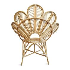 a chair made out of wicker with an intricate design on the back and sides