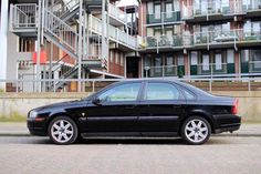 a black car parked in front of a building