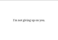 the words i'm not giving up on you are written in black and white