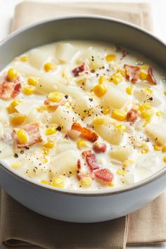 two white bowls filled with soup on top of a gray counter next to each other