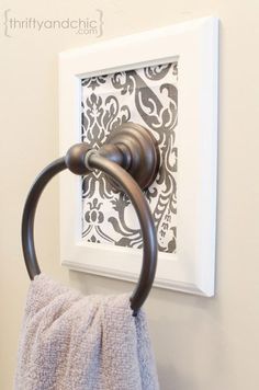 an image of a towel rack on the wall with a towel hanging from it's holder