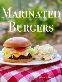 a plate with a hamburger and coleslaw on it next to the words marinated burgers