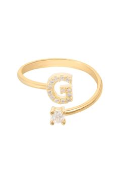 Design: This simple but beautifully styled initial letter ring is perfect for those who covet delicate jewellery with a hint of sparkle offering a sophisticated finishing touch to any outfit. Pretty and petite, this initial ring features an open band, which allows for slight adjustability with sizing. The opening is designed to be on top of your finger, where your zircon adorned monogram is on one side and a single larger cubic zirconia resides on the other. What can be more personal than a name Initial Ring Gold, Gold Initial Ring, Delicate Jewellery, Large Stud Earrings, Gemstone Earrings Gold, Gold G, Zierlicher Ring, Letter Ring, Writing Gifts