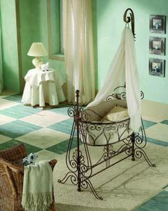 a baby's crib in a room with green walls and checkered flooring