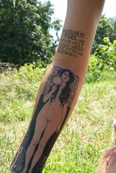 a person with a tattoo on their arm