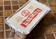 a piece of tin foil sitting on top of a tiled floor