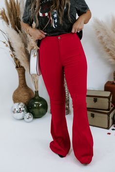 These show-stopping cherry red flares are made for those days when plain blue jeans just simply won't cut it. Gorgeous and ready to take the town! Ultra High Rise Fabric: 76% Cotton, 20% Polyester, 4% Spandex Details: Two back pocket design, button closure with zipper fly, ultra comfortable, breathable fabrication. Imported Fit: True to size- Ultra high rise- If you are in between sizes, size down- Very Stretchy- Ultra comfortable- Inseam: 31"Model Specs: Emily is wearing a size small in the pho Stretch Flare Jeans For Night Out, Red High Waist Fitted Flare Jeans, Red Fitted High Waist Flare Jeans, Fitted Red Flare Jeans For Spring, Red Full-length Jeans For Spring, Red Stretch Wide Leg Jeans, Red Stretch Wide-leg Flare Jeans, Trendy Red Full-length Jeans, Red Stretch Wide-leg Jeans