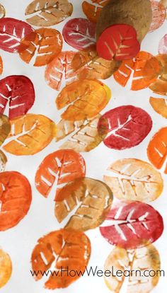 an image of fall leaves painted on paper