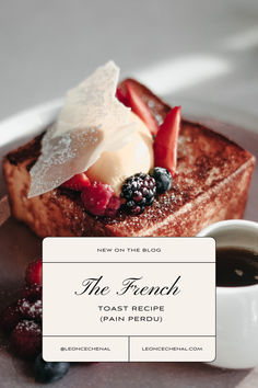 the french toast is topped with berries and whipped cream