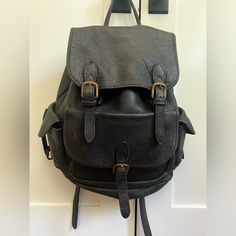 Vintage Black Genuine Leather Backpack. Perfect For School, Travel, Or Just Day To Day. - Three Outer Pockets + One Extra Large Main Compartment With Internal Cinch Closure. - Adjustable Shoulder Straps. - Exterior Brass Colored Hardware. - Interior Small Zipper Pocket. - Purchased In Uk (Over 30+ Years Ago) Thick, Soft, Buttery Leather In Nearly Perfect Condition. Natural Wear, But The Kind That Gets Better With Time. Excellent Condition. Black Backpack With Gunmetal Hardware For Travel, Black Travel Backpack With Gunmetal Hardware, Everyday Backpack With Gunmetal Hardware, Black Leather Backpack With Gunmetal Hardware For Daily Use, Black Leather Backpack With Gunmetal Hardware, Black Backpack With Gunmetal Hardware, Leather Backpack With Gunmetal Hardware, Black Leather Backpack With Adjustable Strap, Black Leather Backpack With Adjustable Strap For Everyday