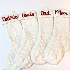 three white knitted socks with red letters on them that say,'cerric louis mom '