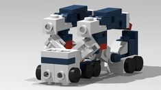 two legos sitting on top of each other in the shape of a robot with wheels