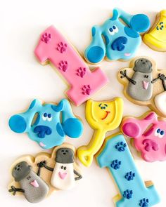 decorated cookies are arranged in the shape of letters and numbers for children's birthdays