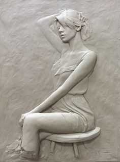 a sculpture of a woman sitting on a bench