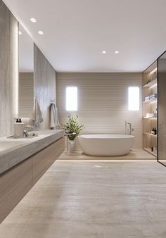 a large bathroom with a tub and sink