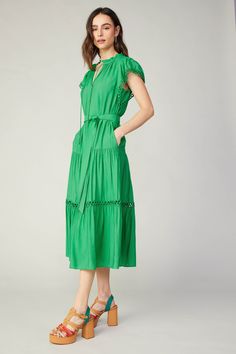 This midi dress has an effortless feel thanks to its easy shape, but the details make it special. Ruffle trim and slender ties accent the neckline, while open eyelet trim adds texture at the sleeves and skirt. Belt it to define your waist. •Pockets•Split neckline with self-tie •Ruffle trim •Short sleeves •Optional self-tie belt •Tiered skirt •Relaxed fit •Lined DIMENSIONS •Standard: 49" Length Item number 2490151 55% Rayon 45% Polyester Gentle Cycle cold Easy Shape, Tiered Midi Dress, Skirt Belt, Green Outfit, Print Trends, Lace Midi, Eyelet Lace, Lace Midi Dress, Vacation Dresses