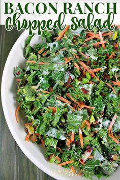 a salad with carrots and lettuce in a white bowl